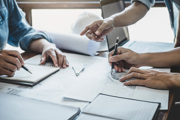 Engineer Teamwork Meeting, Drawing working on blueprint meeting for project working with partner on model building and engineering tools in working site, Construction and structure concept