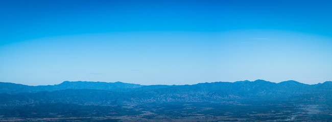 Fototapeta na wymiar Autumn of Thailand with landscape mountains and blue sky natural background.