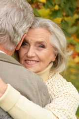 beautiful senior couple relaxing in the park