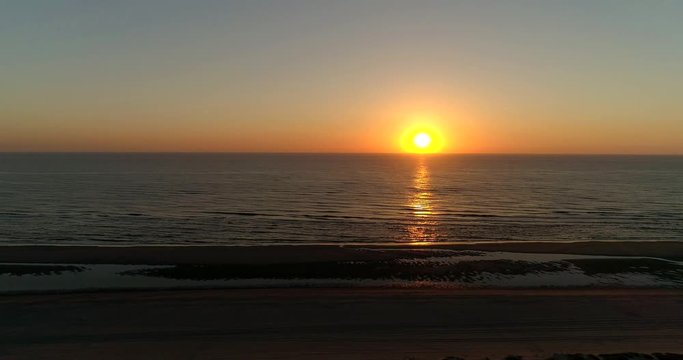 Beautiful Sunset Red Sky Beach Moving Left, Noordwijk, Netherlands / Holland (4K Drone Footage)