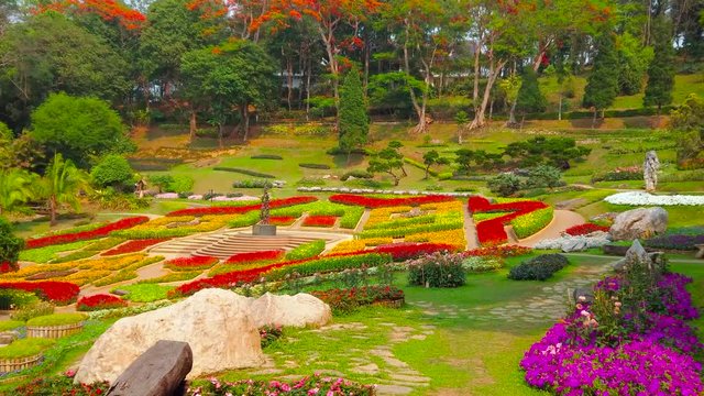 CHIANG RAI, THAILAND - MAY 9, 2019: Mae Fah Luang garden boasts amazing flower beds, covering with colorful carpet the mountain slope, Doi Tung, on May 9 in Chiang Rai