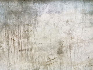 Old cemented flooring with stains and blurry patterned backgrounds