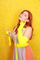 cute fashion lady with long satin fashion yellow gloves