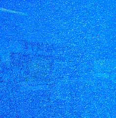 Blue broken glass in a fine mesh