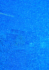 Blue broken glass in a fine mesh