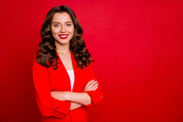 Amazing business lady with crossed arms dressed formal wear red jacket isolated burgundy background