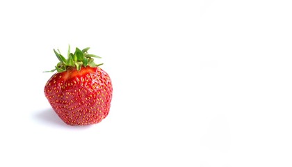 Strawberry lies on a white background, isolate, place for text