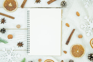 Top view Christmas and New Year background with notepad and decorations. To do list or list of promises, copy space for your text. Flat lay mock up