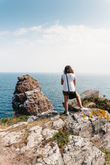 Beautiful woman looking at seascape in Brittany