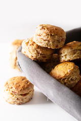 Food concept Fresh baked Homemade buttery, salty Ham and cheese scones on white background.