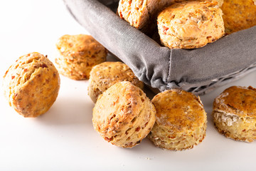 Food concept Fresh baked Homemade buttery, salty Ham and cheese scones on white background.