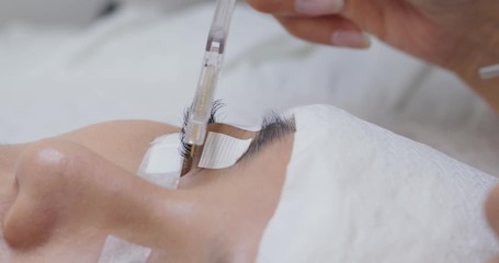 Beautiful young woman with eyelash extension