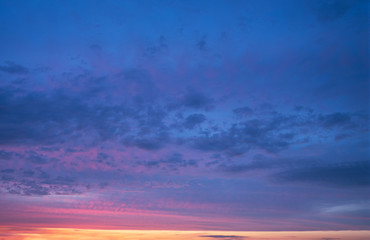 Naklejka na ściany i meble dramatic cloudy sunset sky blue hour abstract background