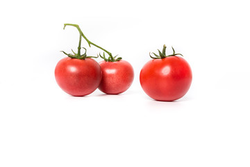 Cherry tomatoes. Three cherry tomatoes isolated on white background