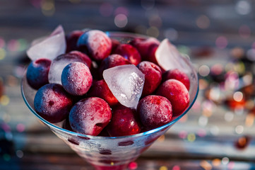 Fresh organic sour cherries in an icy bowl