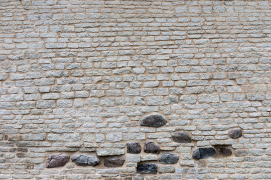 Texture of a stone wall. Old castle stone wall texture background. Stone wall as a background or texture. Part of a stone wall, for background or texture. © Roman