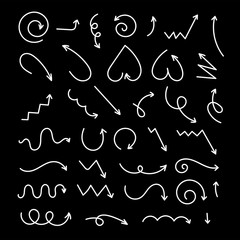 Collection of hand-drawn doodle arrows on black background