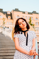 Fototapeta premium Elegant young lady walking outdoors in the city