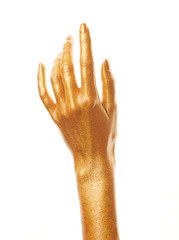 Hands in gold paint. Golden fingers. Female hand isolated on white background. White woman's hand showing symbols and gestures.
