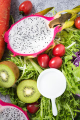 Vegetables and fruits on a dark rustic wooden table. Healthy vegetarian food.