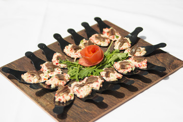 Russian salad served in a spoon