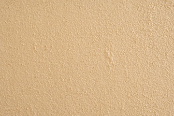 Brown cement wall background close up