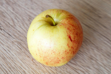 Naklejka na ściany i meble close up red apple isolated on wood background