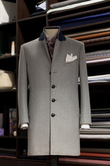 Mannequin with bespoke grey coat in atelier