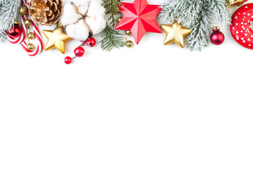 Christmas border or banner with stars, fir branch, holly berries and baubles isolated on white background
