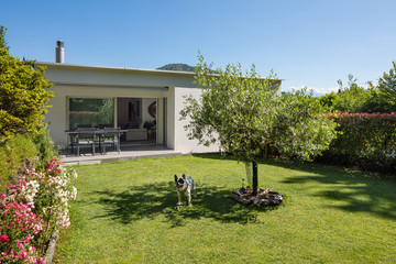 House with garden by day in the middle of summer in Switzerland