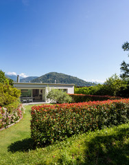 House with garden by day in the middle of summer in Switzerland