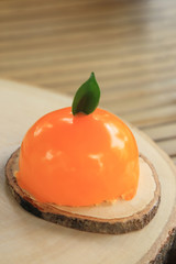 Delicious orange juice cake in orange fruit shape.