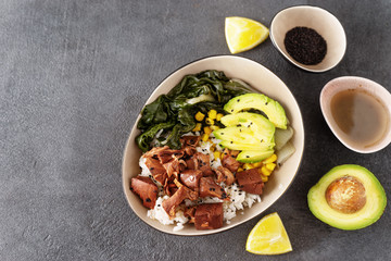 Obraz na płótnie Canvas Top view of vegan healthy bowl with rice, salad and jackfruit