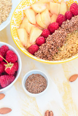 healthy breakfast oatmeal with fruits, raspberries, peach, flax seeds, nuts, good morning concept, healthy food, healthy breakfast
