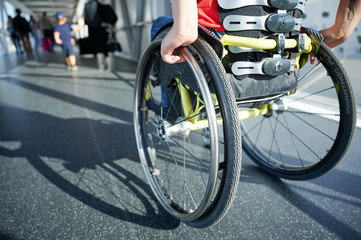 Fototapeta na wymiar Young woman in wheelchair in a corridor