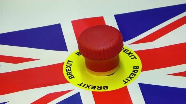 Hand pushing panic button with brexit text and Britain flag. Conceptual Britain exit of European Union footage