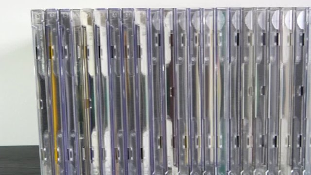 Group of CD or compact discs on table