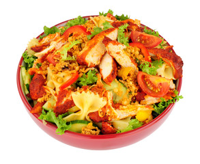 Chicken tikka and pasta salad bowl isolated on a white background