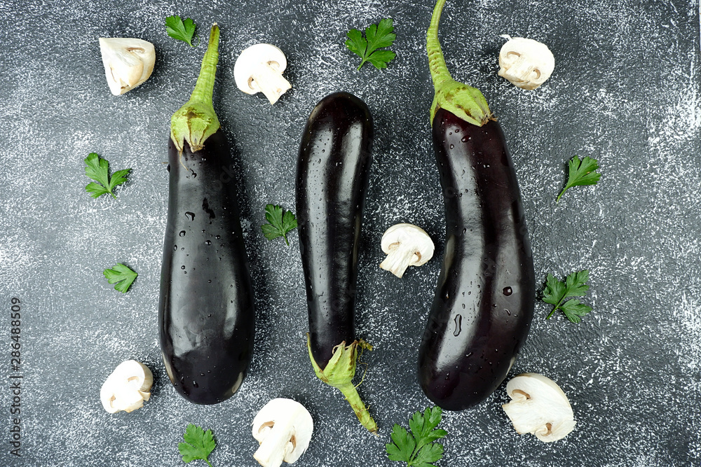 Wall mural eggplant on a black background. view from above