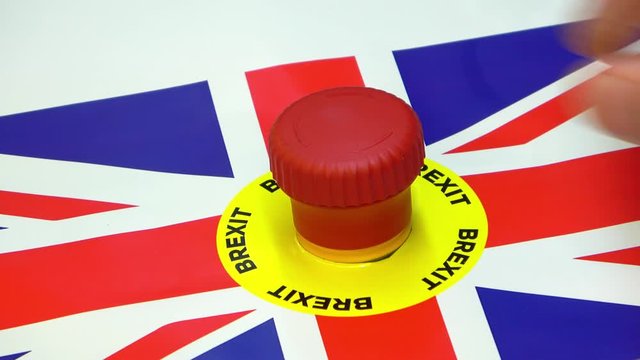 Hand pushing panic button with brexit text and Britain flag. Conceptual Britain exit of European Union footage