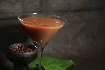 bowl with tobacco for hookah. berries on a black background