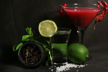 bowl with tobacco for hookah. berries on a black background