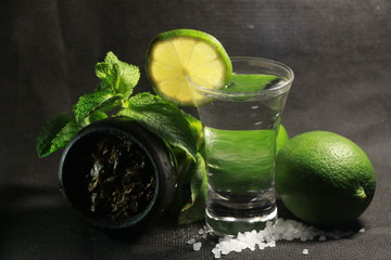 bowl with hookah tobacco. berries on a black background. nargile smoking