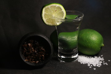 bowl with tobacco for hookah. fruits on a black background
