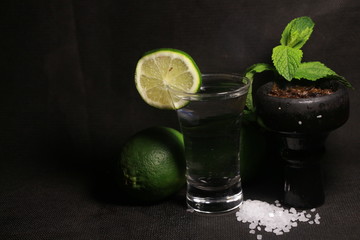 bowl with tobacco for hookah. berries on a black background