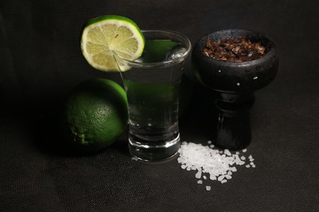 bowl with tobacco for hookah. fruits on a black background