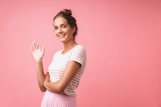 Image Of Gorgeous Beautiful Woman Wearing Striped Clothes Smiling And Waving At Camera