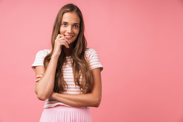 Image of pleased beautiful girl wearing striped clothes smiling and looking at camera