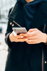 Close-up female's hands holding smart phone