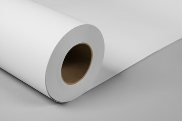 Blank white paper rolls isolated on gray background. Mockup paper for magazines, catalogs or newspapers isolated on gray backdrop, Printing house theme or wrapping paper for presents